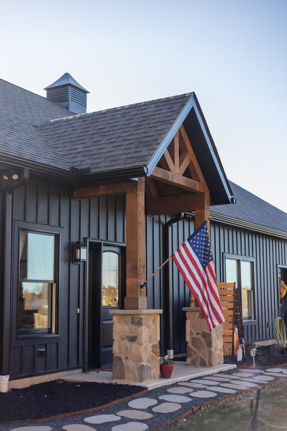 Modern farmhouse exterior with stone accents