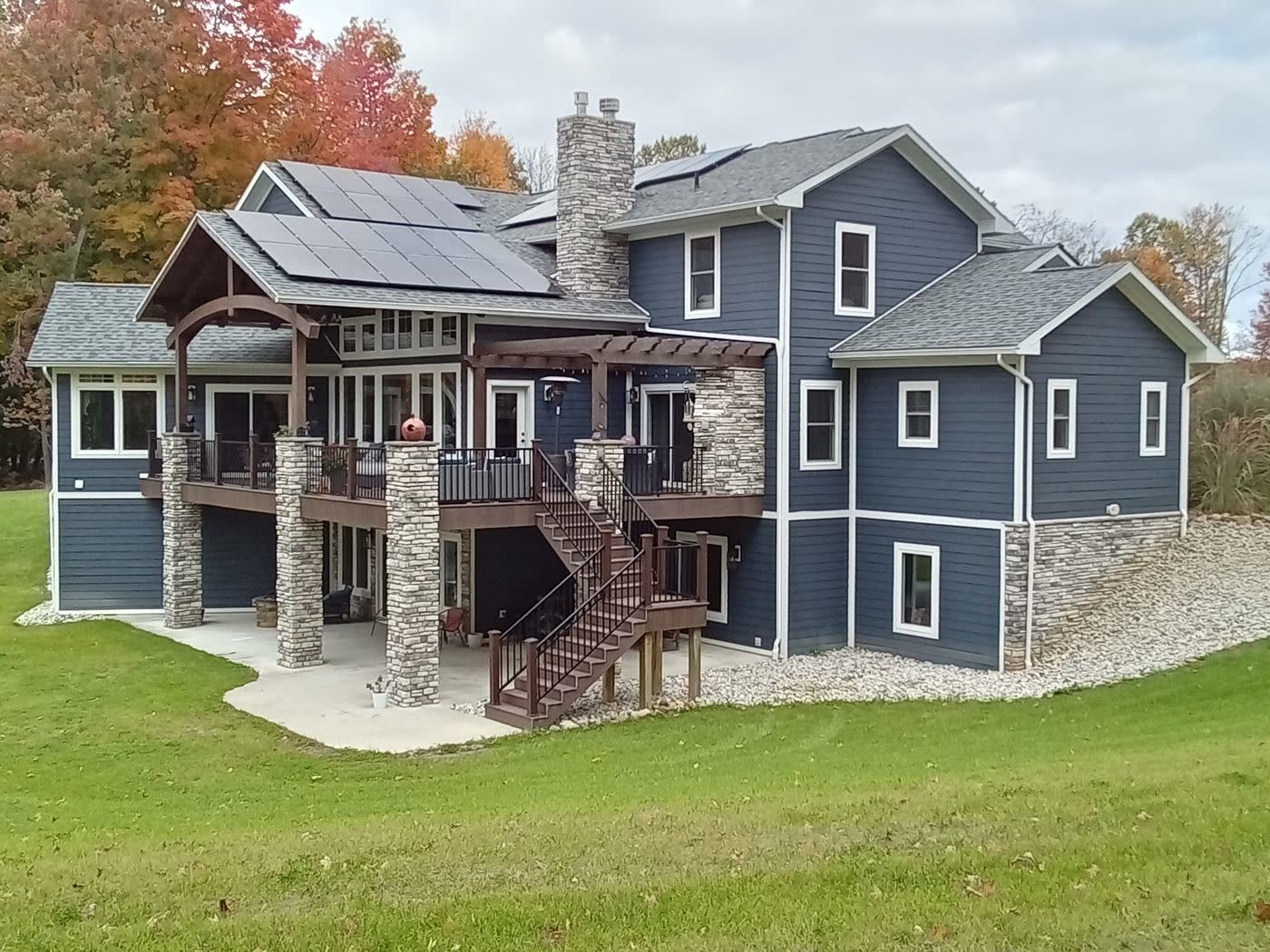 Three-story custom home with stonework