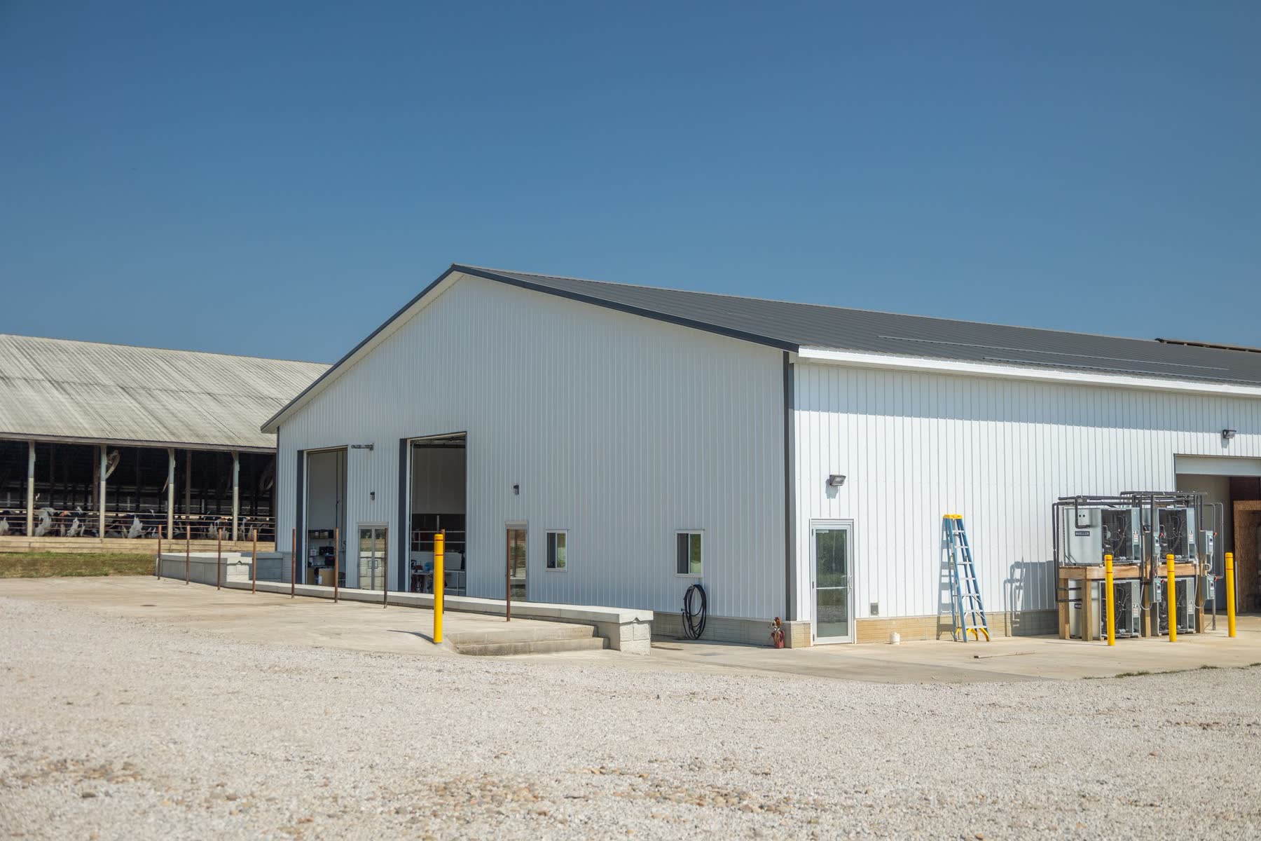 Metal agricultural building exterior with overhead doors