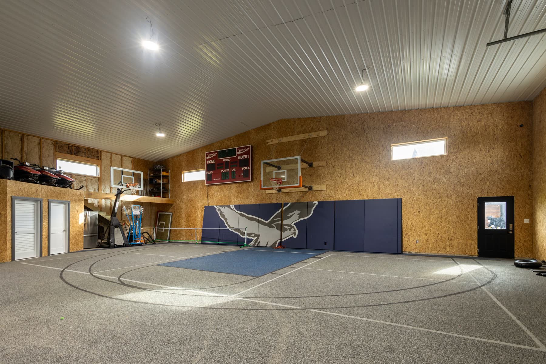 Indoor sport court inside an attached homestead shop