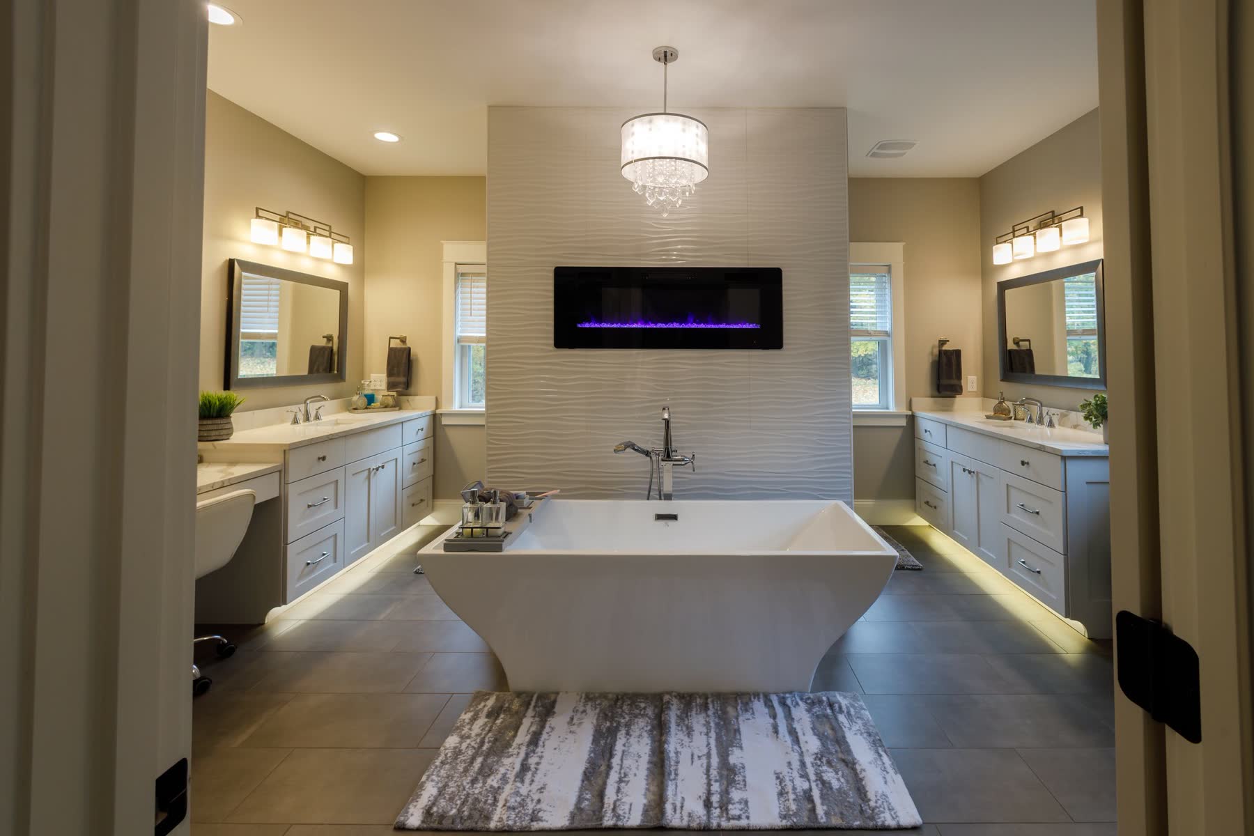 Primary bathroom with freestanding tub and built-in fireplace