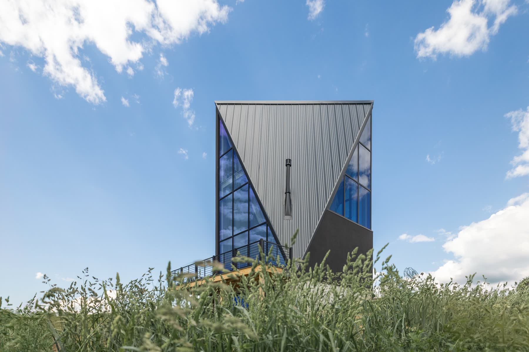 Modern A-frame vacation rental with floor-to-ceiling glass