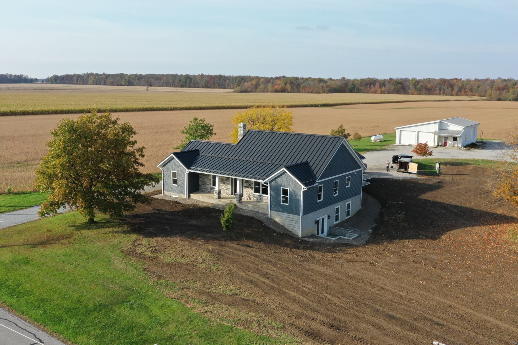 Aerial view of the finished Wayne County custom home surrounded by farmland