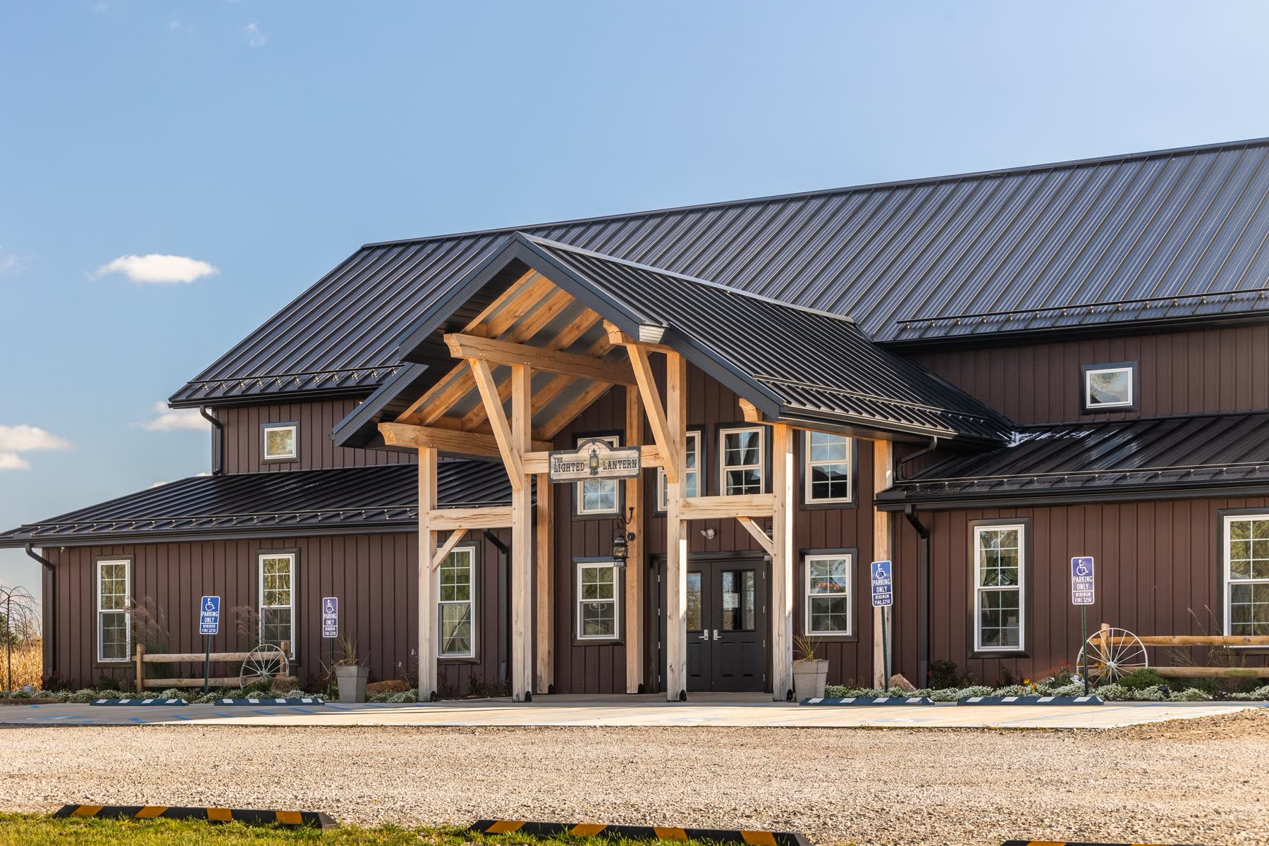 The Lighted Lantern event venue entrance with timber-frame portico