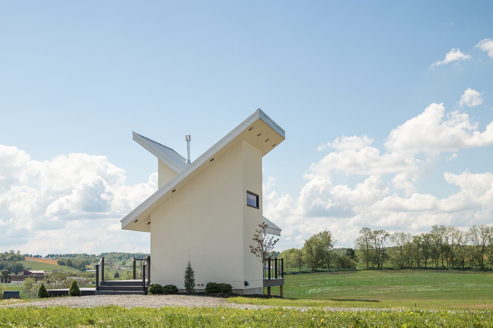Distinctive angular custom home with a cantilevered roofline